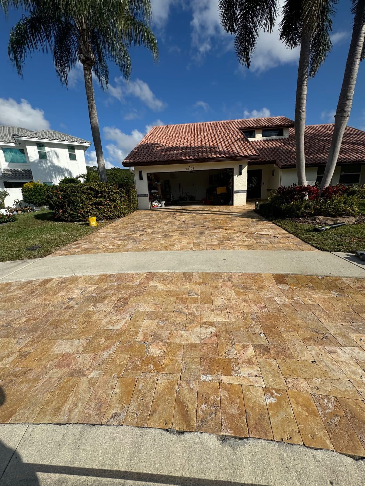 Travertine paver walkway with a clean wet-look finish